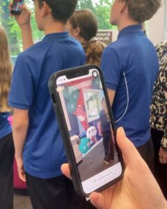 Previewing Augmented reality animations. Collaborative mural with a group of year 9s, helping them re-design the Young Adult area of Loughborough Library. We ran a series of workshops and reshaped the student artwork into scene which we coached them to help install. Amanda Rigby
