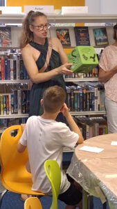 community engaged art workshop with Paper Rhino developing a giant hand painted game board co-produced with school children at Mountsorrel Library