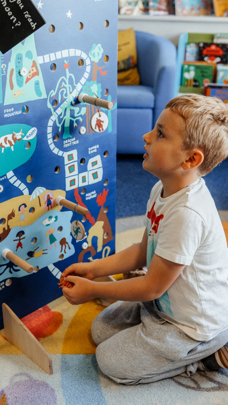 community engaged art workshop with Paper Rhino developing a giant hand painted game board co-produced with school children at Mountsorrel Library