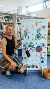 Amanda Rigby from Paper Rhino speaking to local community about a giant hand painted game board co-produced with school children for Culture Leicestershire