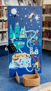 community engaged art workshop with Paper Rhino developing a giant hand painted game board co-produced with school children at Mountsorrel Library